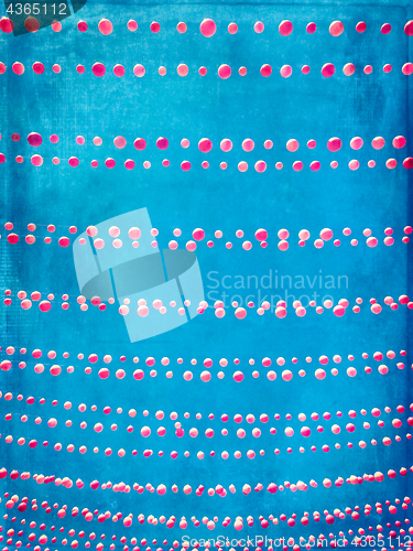 Image of Grungy image of blue sky decorated with pink balloons