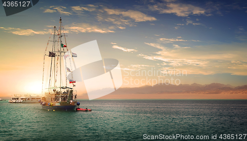 Image of Sailboat at sunny sunset