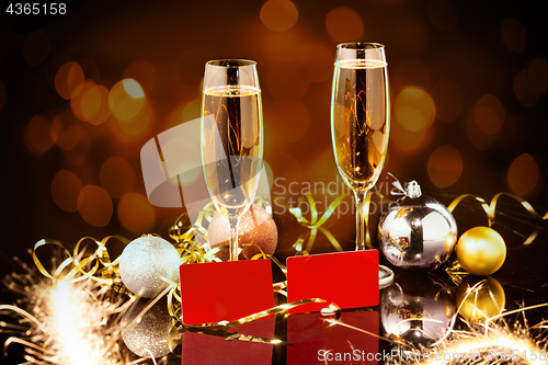 Image of Christmas and New Year celebration with champagne. New Year holiday decorated table. Two Champagne Glasses
