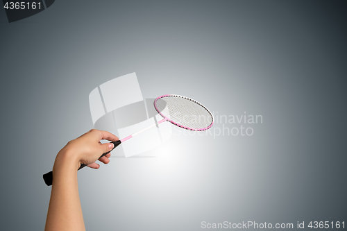 Image of Color photo of one racket for badminton