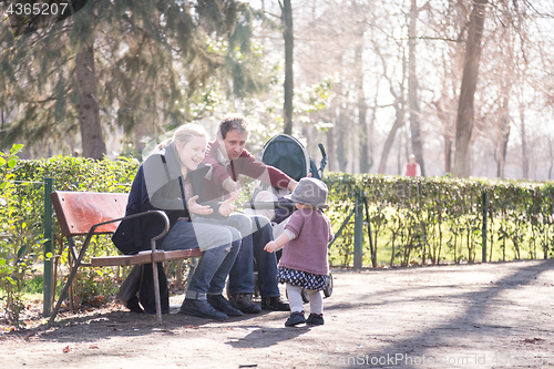 Image of Family with child. First steps of the kid in the big world.