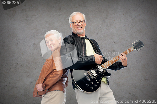 Image of happy senior couple with electric guitar