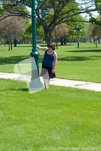 Image of Girl Spinning Around Pole