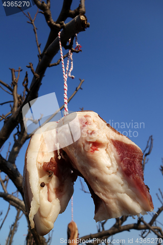 Image of The meat drying outside on the sun