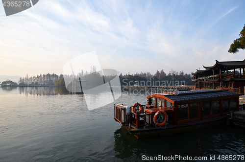Image of Chinese Xihu lake in Hangzhou with color boat 
