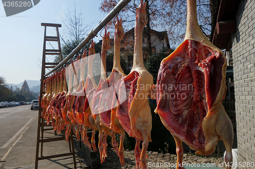 Image of The meat drying outside on the sun