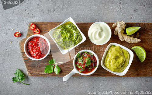 Image of various sauces on grey table