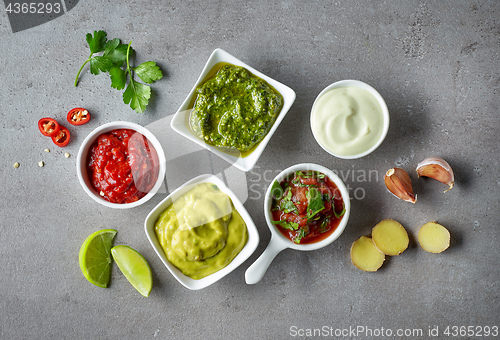 Image of various sauces on grey table