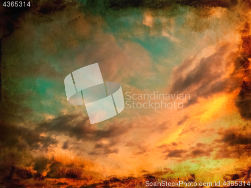 Image of Vintage sunset sky background with burnt edges