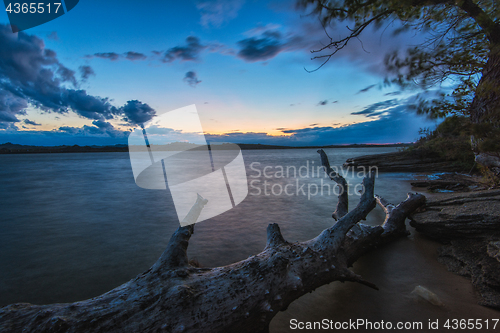 Image of Landscape with sunset and snag