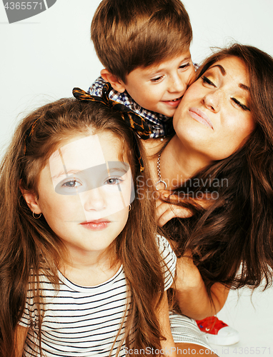 Image of two pretty children kissing their mother happy smiling close up,