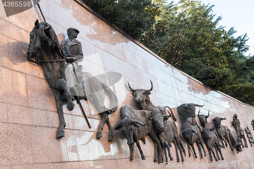 Image of Wall statuee \'Run of Bulls\' at the Plaza de Toros de Las Ventas, Madrid, Spain.