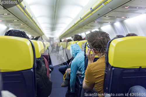 Image of Interior of commercial airplane during flight.