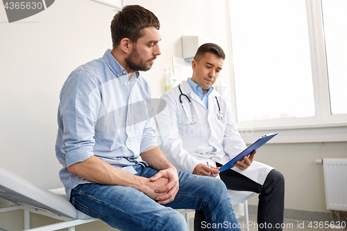 Image of doctor and man with health problem at hospital