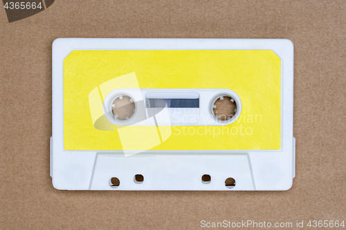 Image of Retro white audio tape with yellow label