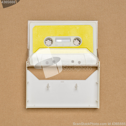 Image of Retro white audio tape with yellow label