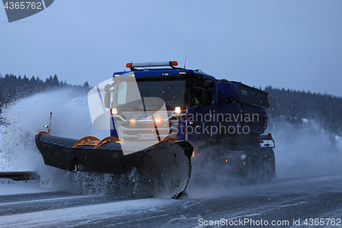 Image of Snowplow on the Road at Night