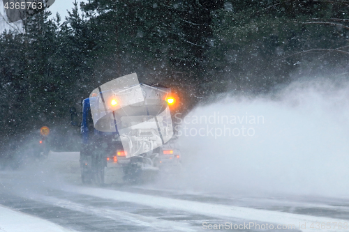 Image of Snowplow Clears Road, Rear View
