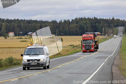 Image of Pilot Vehicle Leads Wide Load Transport