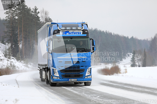 Image of Blue Volvo FH Semi on Winter Road