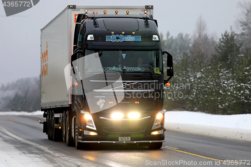 Image of Black Volvo FH Semi Headlights in Winter