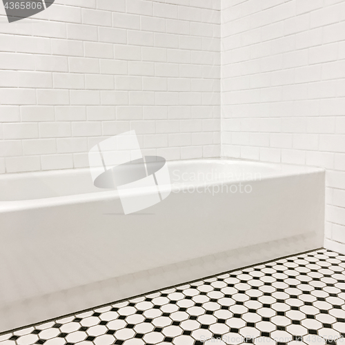 Image of New bathroom with ceramic tile walls and floor