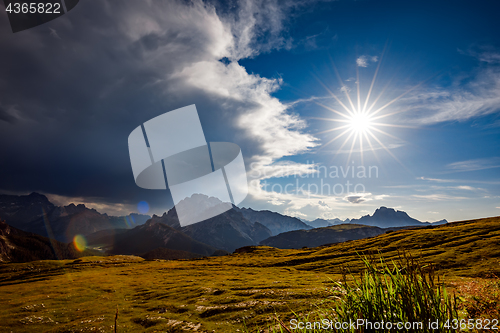 Image of A storm cloud is coming in the sun. The beginning of the storm.