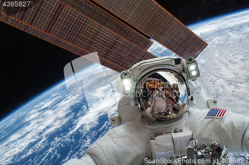 Image of International Space Station and astronaut.