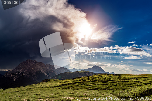 Image of A storm cloud is coming in the sun. The beginning of the storm.