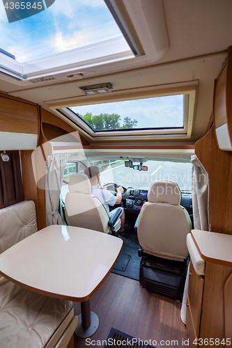 Image of Man driving on a road in the Camper Van RV