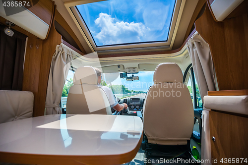 Image of Man driving on a road in the Camper Van RV