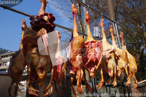 Image of The meat drying outside on the sun