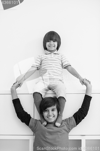 Image of young boys posing line up piggyback