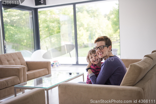 Image of mother and cute little girl enjoying their free time