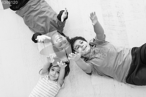 Image of young boys having fun on the floor