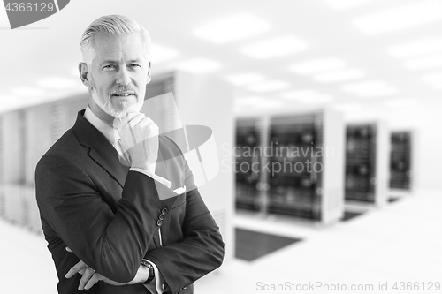 Image of Senior businessman in server room