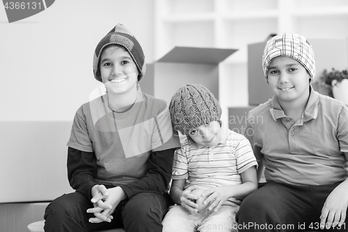 Image of boys with cardboard boxes around them