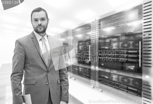 Image of Young businessman in server room