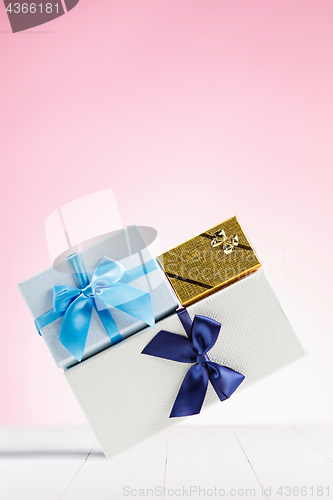 Image of Gift box wrapped in recycled paper with ribbon bow