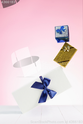 Image of Gift box wrapped in recycled paper with ribbon bow