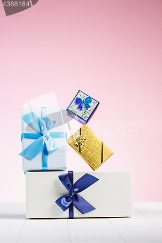 Image of Gift box wrapped in recycled paper with ribbon bow