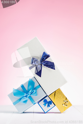 Image of Gift box wrapped in recycled paper with ribbon bow