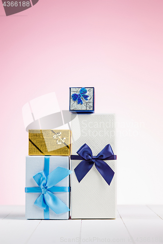 Image of Gift box wrapped in recycled paper with ribbon bow