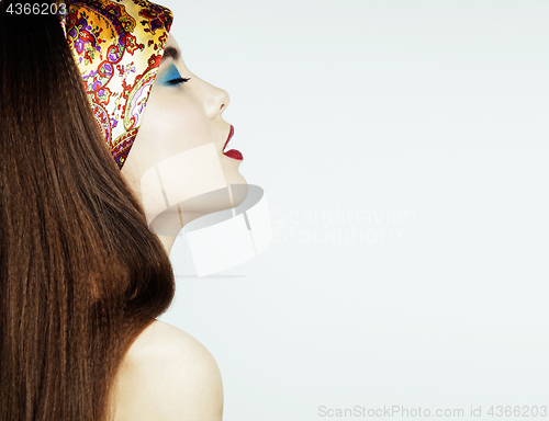 Image of young pretty modern girl with bright shawl on head emotional posing isolated on white background, lifestyle people concept