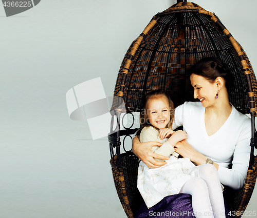 Image of Portrait of mother and daughter at home, happy family in chair