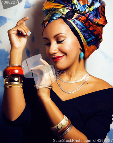 Image of beauty bright african woman with creative make up, shawl on head like cubian closeup