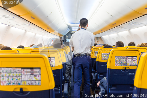 Image of Interior of commercial airplane during flight.