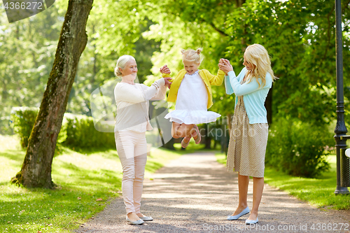 Image of happy mother, daughter and grandmother at park