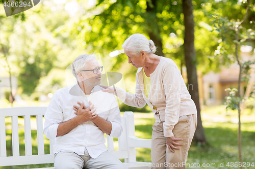 Image of senior man feeling sick at summer park