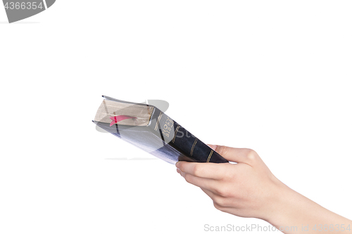 Image of Woman hand holding the Holy Bible